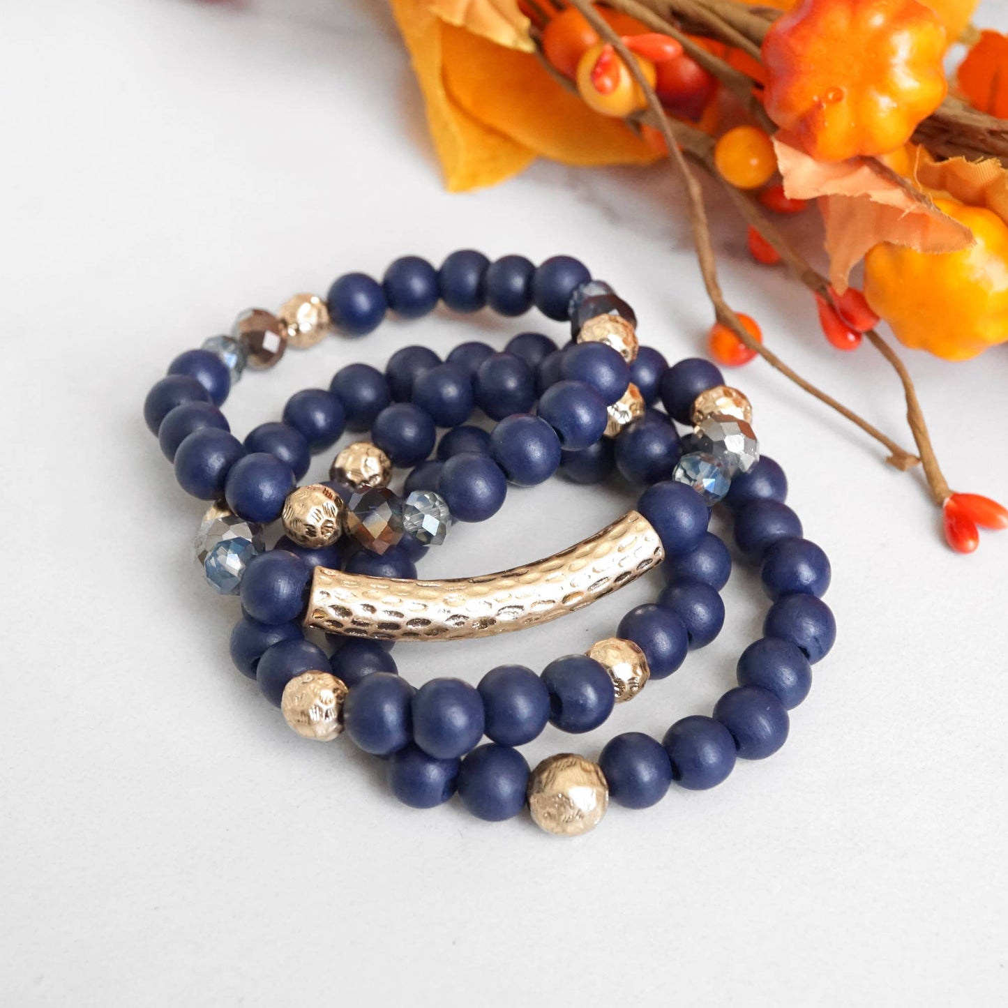 Beaded bracelets set in Wooden Navy Blue and Gold tube