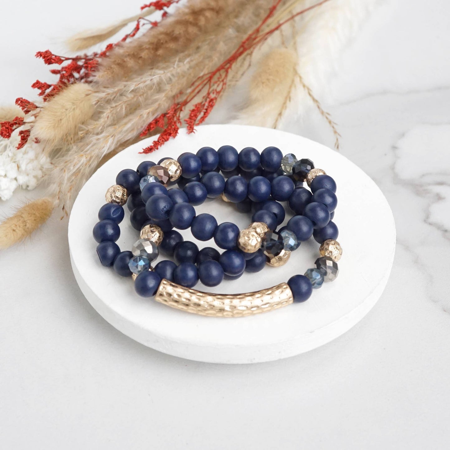 Beaded bracelets set in Wooden Navy Blue and Gold tube